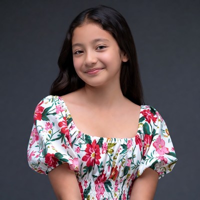 Asian girl in floral dress smiling