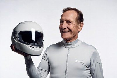 Smiling man holding white helmet