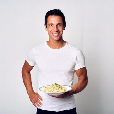 Man holding pasta dish