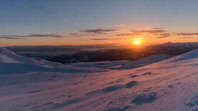Sunset over snowy mountains