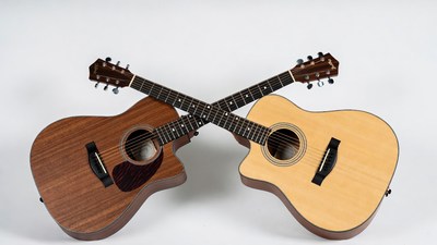 Crossed Acoustic Guitars on White Background