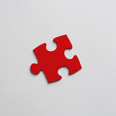 Red puzzle piece on white