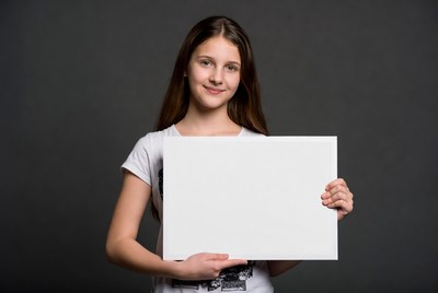 Girl holding blank white sign