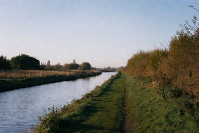 Narrow canal with grassy path