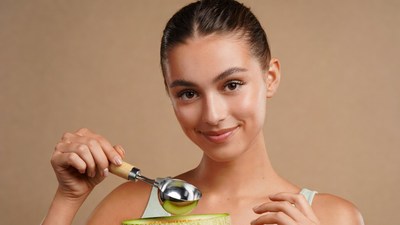 Woman holding melon baller