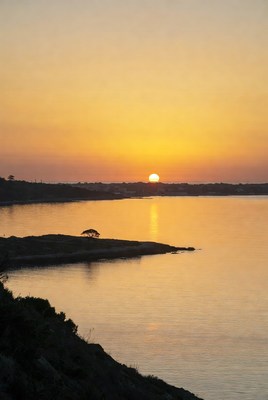 Sunset over calm lake