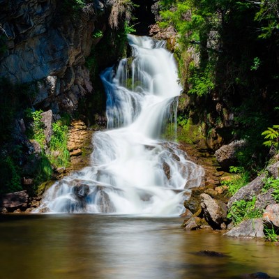 Waterfall cascading over rocky cliffs