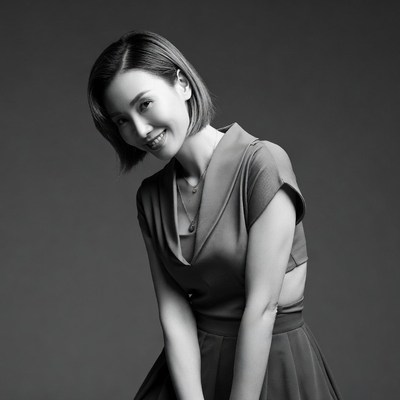 Asian woman smiling in black dress