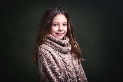Girl smiling in turtleneck sweater