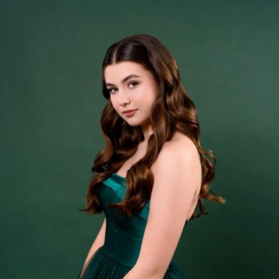 Teen girl in green prom dress