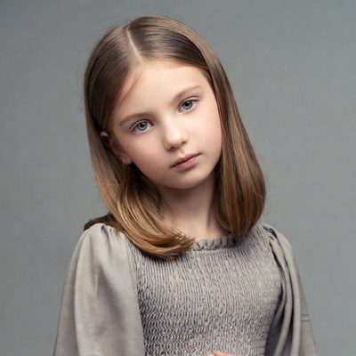 Young girl in gray dress