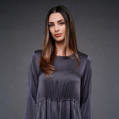 Woman in gray silk dress