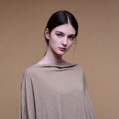 Woman in beige off-shoulder dress