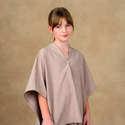 Girl in beige cape coat