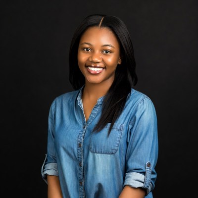 Smiling African-American woman in blue denim shirt