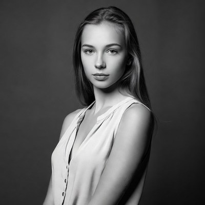 Young woman in white tank top