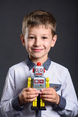 Boy holding toy robot