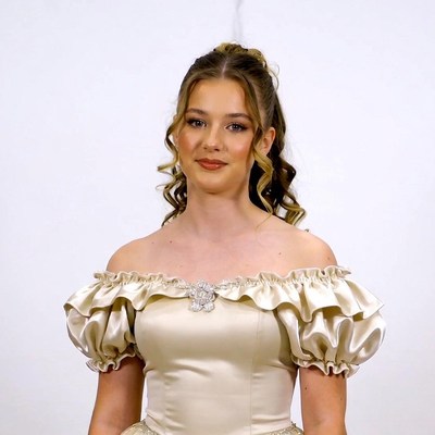 Young woman in off-shoulder gown