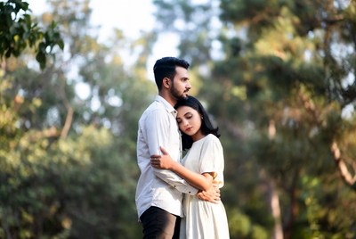 Indian couple embracing in forest