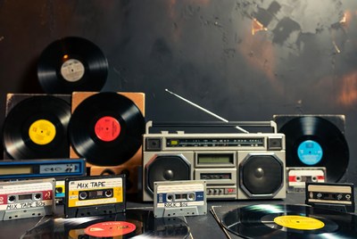 Vintage Boombox with Vinyl Records and Cassettes