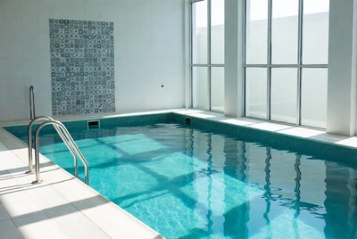 Empty indoor swimming pool with tiles