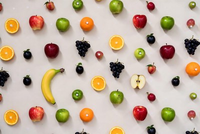 Assortment of fresh fruits on beige background