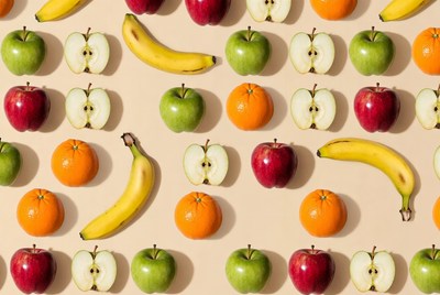 Assortment of sliced fruits on beige background