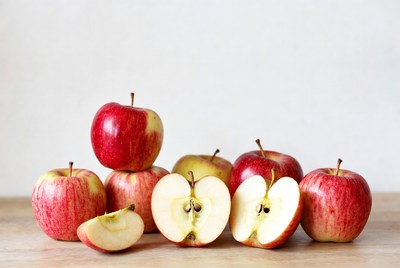 Red Apples Sliced on Wooden Table