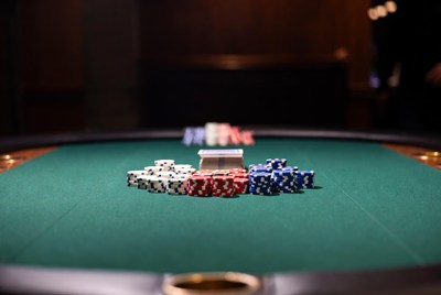 Poker chips stacks on green table