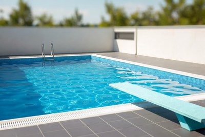 Blue Swimming Pool with Diving Board