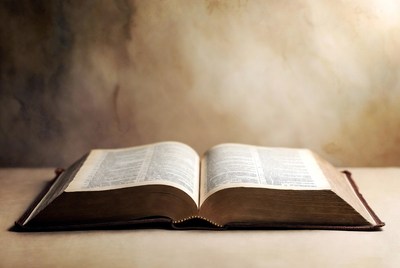Open Bible on wooden surface