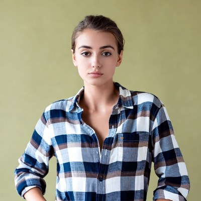 Young woman in plaid shirt