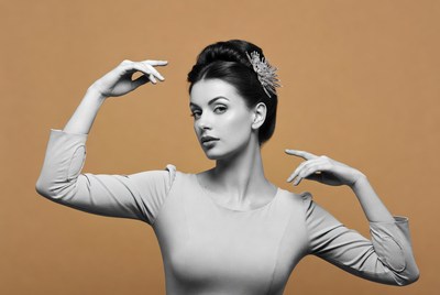 Woman posing with hands up in vintage style