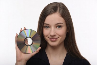 Young woman holding CD