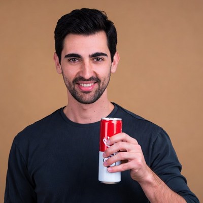Man holding red energy drink