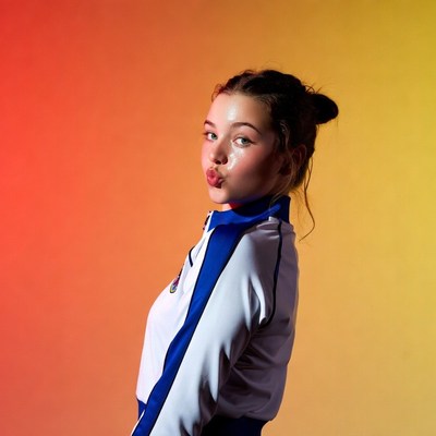Girl puckering lips in blue tracksuit