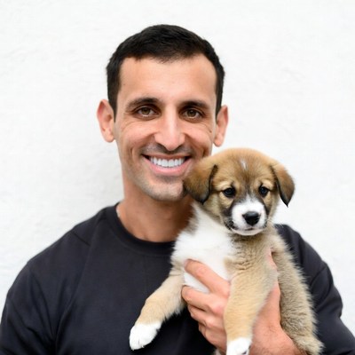 Man holding cute puppy