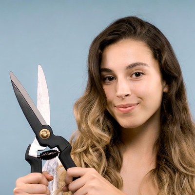 Young woman holding pruning shears
