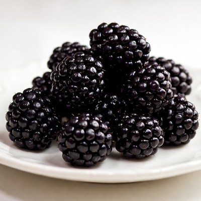 Fresh Blackberries on White Plate