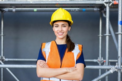 Woman in hi-vis vest and hard hat