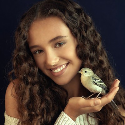 Girl holding small bird