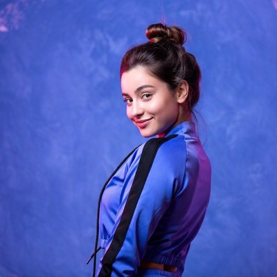 Smiling woman in blue tracksuit