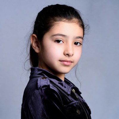 Young girl in purple velvet jacket