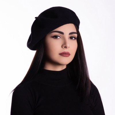 Woman wearing black beret