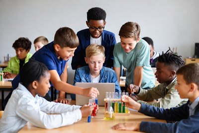 Diverse children collaborating on science experiment