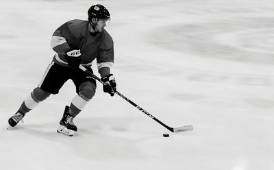 Hockey player shooting puck
