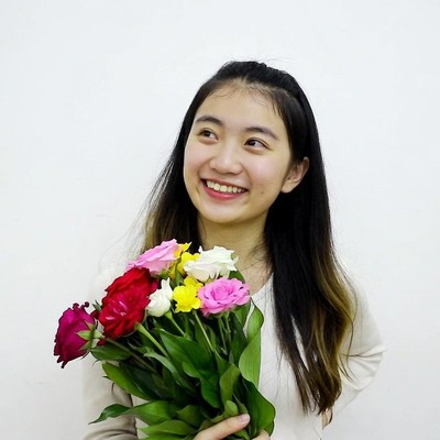 Asian girl holding colorful bouquet