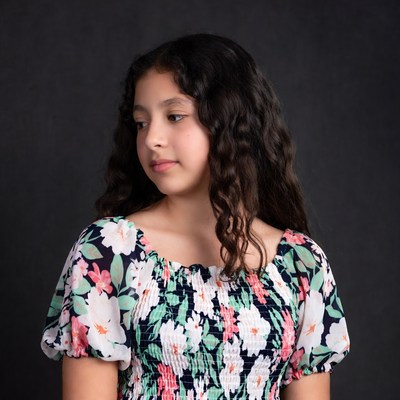 Girl in floral dress profile view