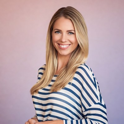 Blonde woman smiling in striped shirt