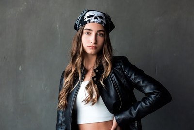 Woman in leather jacket with skull bandana